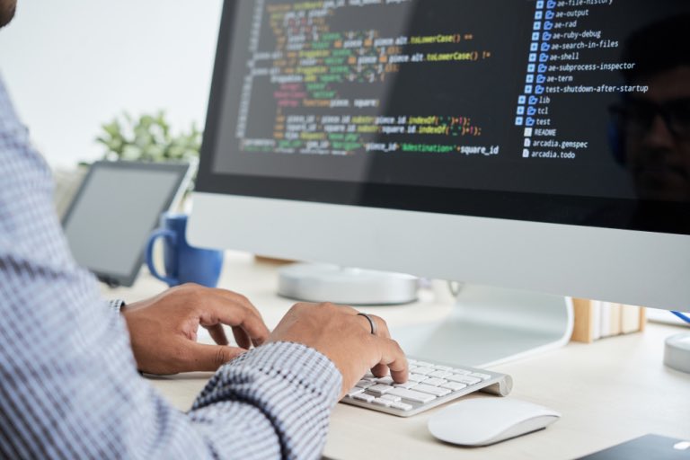 Hands at work developing software